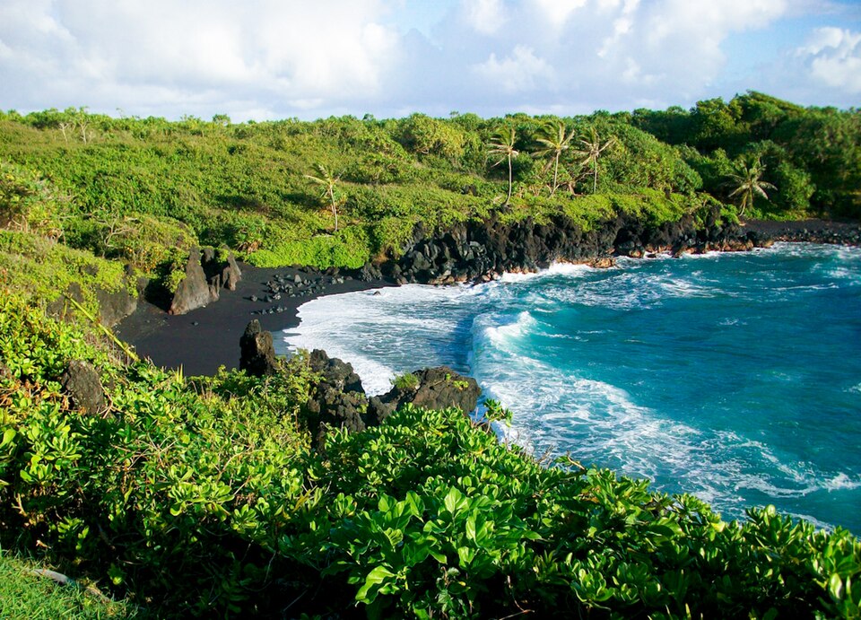 Black sand beach and coastline at Waiʻānapanapa State Park on Maui.